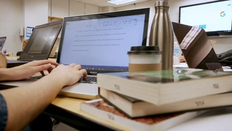 Cropped shot of a man’s hands typing on a laptop with a mug of coffee Stock Footage 88565508