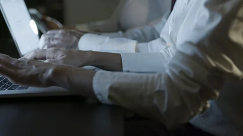 Cropped shot of people using computers in dark office Stock Footage 120593239