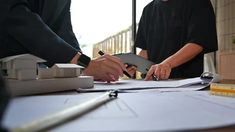 Cropped shot of two architect man examining building model, working on project Stock Footage 251560096