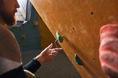Cropped shot of unrecognizable boulderer preparing rock wall for trainings Stock Photos