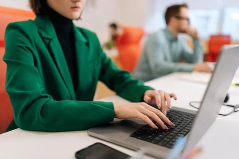 Cropped shot of unrecognizable female developer typing program code on laptop Stock Photos