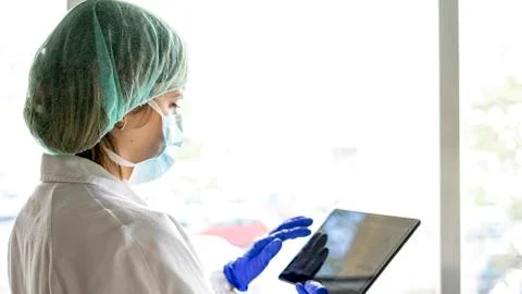 Cropped shot of an unrecognizable female nurse using a digital tablet while s Stock Photos