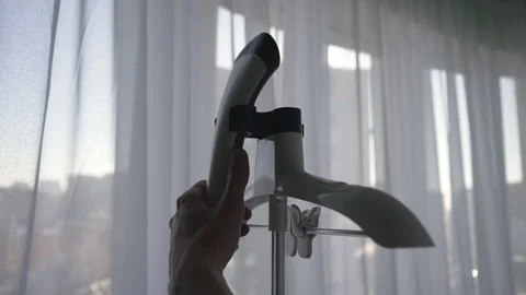 Cropped shot of unrecognizable housekeeper preparing to steam clothes, attaching Stock Footage 304879716