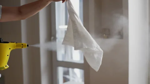 Cropped shot of unrecognizable young man working hot wet steam on pillowcase Stock Footage 267641026