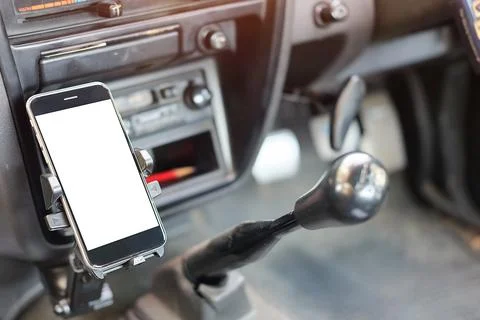 Cropped shot view The driver uses the phone while driving. Modern smart phone Foto stock