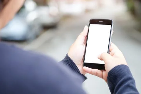 Cropped shot view of man hands holding smart phone with blank copy space scre Foto stock