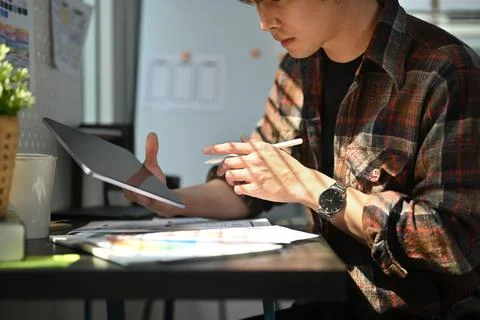 Cropped shot of web developer using digital tablet, working on mobile Stock Photos