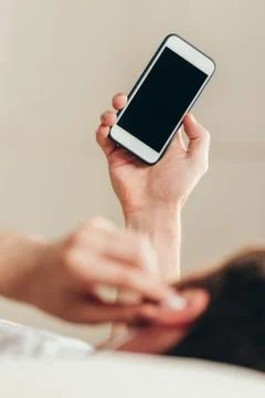 Cropped shot of young man using smartphone with blank screen Stock Photos