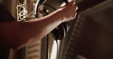 Cropped singer taking headphones in studio Video stock 201852856
