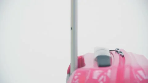 Cropped slowmotion of female pulling a suitcase packed according to all flight Stock Footage 134468791