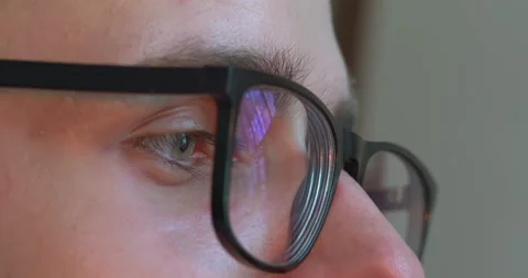 Cropped view of Blinking Eyes, guy wearing black rimmed eyeglasses. Stock Footage 223977129