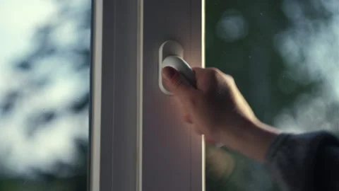 Cropped view of female hand open pvc window with double glazing Stock Footage 243671579