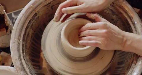 Cropped view of the female making clay pot on the ceramic wheel Stock Footage 207069574