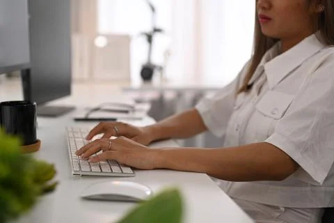 Cropped view of female programmer hands typing on keyboard, writing program code Photos