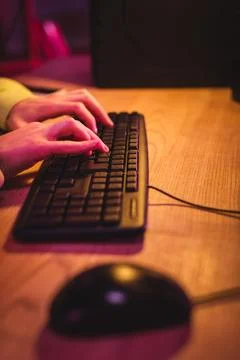Cropped view gamer using computer Stock Photos