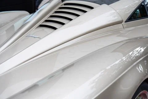 Cropped view of legendary pagani codalunga with brand logotype on bumper Stock Photos