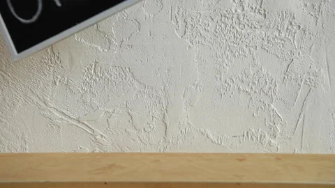 Cropped view of man putting disposable cup near open signboard 库存影片 133784081