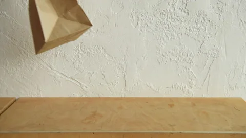 Cropped view of man putting paper bags and disposable cups Stock-Footage 133784914