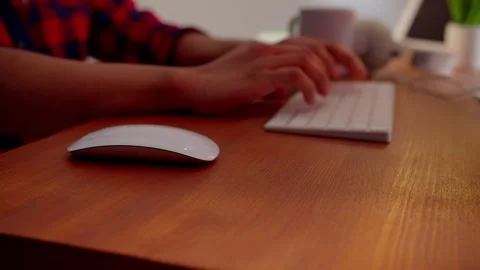 Cropped view of a man sitting at a table and working at a computer. Male hands Video stock 240704280