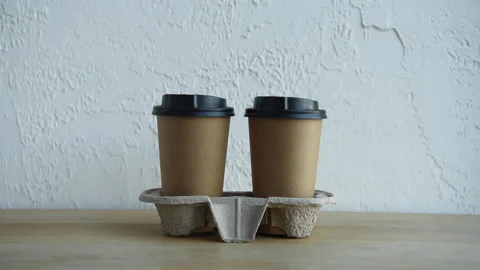 Cropped view of man taking coffee to go in cardboard tray Stock-Footage 133780027
