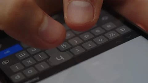 Cropped view of a man using phone keyboard. Partial view of a person texting a Stock Footage 236563698
