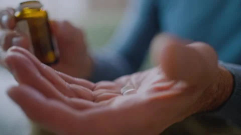 Cropped view of the mature man taking medication cure pills vitamin Stock Footage 260749281