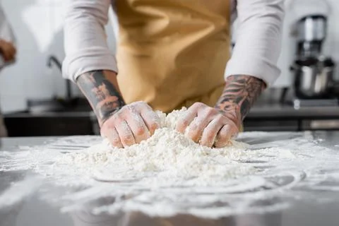 Cropped view tattooed chef making Stock Photos