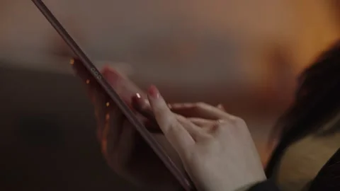 Cropped view of a woman using digital tablet. Female hands typing on tablet Stock Footage 233192276