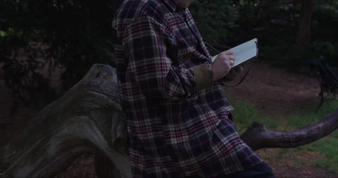 Cropped view of young man journaling outdoors. Stock Footage 313950865