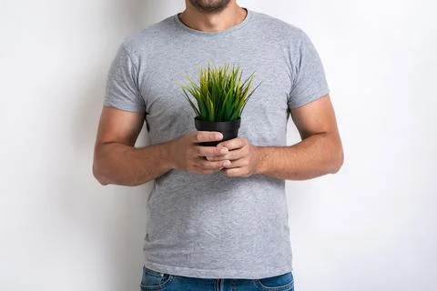 Cropping image - Man with fresh grass pot in his hands .Concept World Envir.. Stock Photos