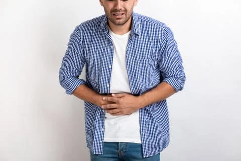 Cropping image of sick man having a abdominal ache, holding for stomach Stock Photos