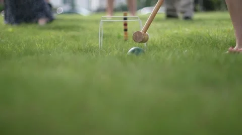 Croquet in backyard super low angle shot Stock Footage 11150078