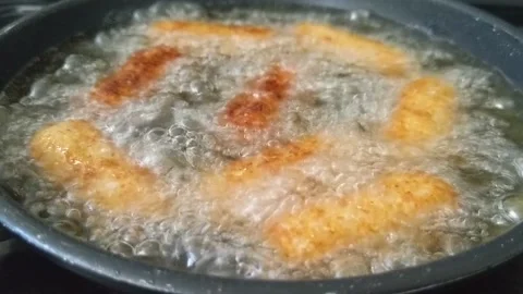 Croquettes frying in a pan Stock Footage 219588651