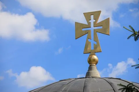 Cross on a background of blue sky Stock Photos
