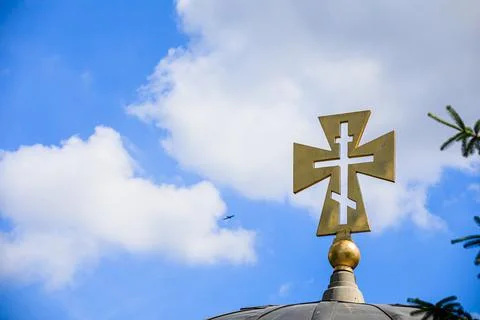 Cross on a background of blue sky Stock Photos