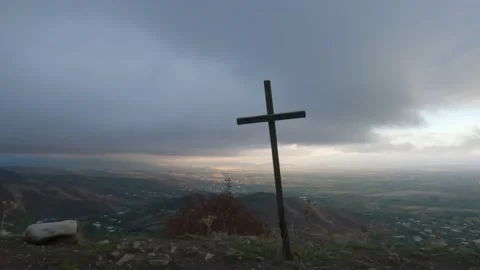 Cross on the background of the valley and the mountains Stock Footage