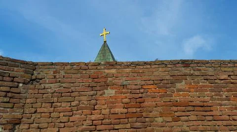 Cross behind the wall Stock Photos