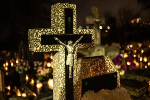 Cross Being Placed At Cemetery Stock Photos