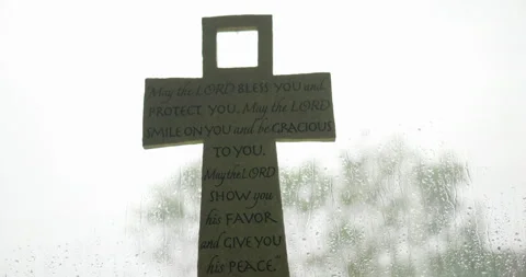 Cross with Bible Scripture and Rain in the background Stock Footage 229826744