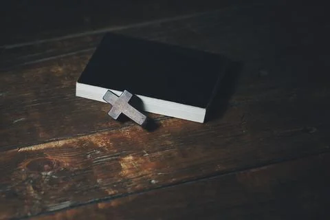 Cross on book Stock Photos