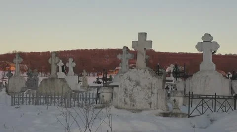 Cross in cemetery during winter time Stock Footage 18670101