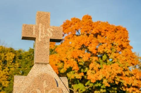 Cross in a cemetery Stock Photos