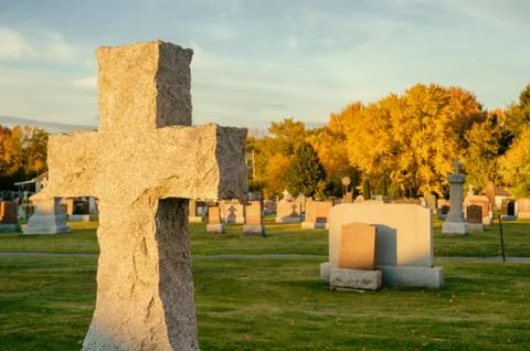 Cross in a cemetery Stock Photos