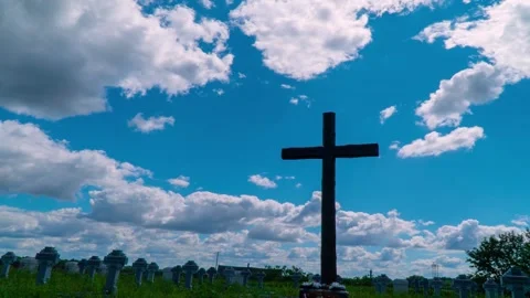 Cross on the cemetery. Time lapse clouds flowing past Stock Footage 145716177