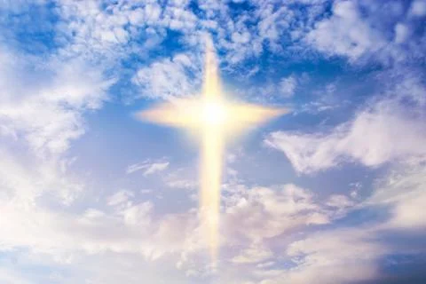 Cross in clouds Stock Photos