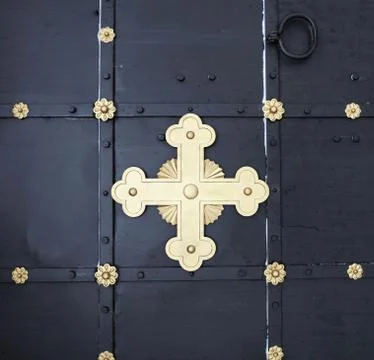 Cross on the door Stock Photos