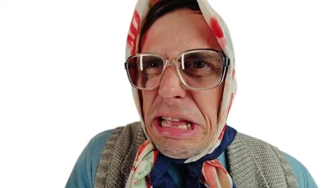 Cross dressing actor as an angry old grandmother shouting and arguing loudly Stock Footage 340193335