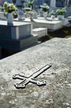 Cross engraved in a tombstone Stock Photos