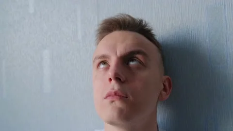 Cross-eyed man talking to himself talking nonsense Stock-Footage 148569054