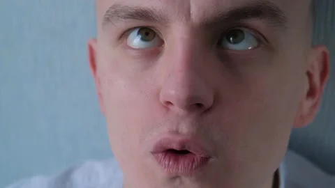 Cross-eyed man talking to himself talking nonsense Stock-Footage 148569686